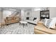 Finished basement with couches, stylish decor, and a staircase at 6045 Haverford Ave, Indianapolis, IN 46220