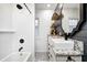 Updated bathroom with a modern sink, patterned floors, and shower and tub combo at 6045 Haverford Ave, Indianapolis, IN 46220