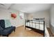 Well-lit bedroom with cozy furniture, a bed, and decorative art at 6045 Haverford Ave, Indianapolis, IN 46220