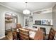 Open floor plan with dining room leading to living room, showcasing hardwood floors at 6045 Haverford Ave, Indianapolis, IN 46220
