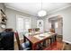 Dining room featuring hardwood floors, ample natural light and sight lines to living spaces at 6045 Haverford Ave, Indianapolis, IN 46220