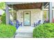 Inviting front porch featuring stone facade and a cozy seating area at 6045 Haverford Ave, Indianapolis, IN 46220