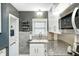 Bright kitchen featuring granite countertops, white cabinets, and stainless steel microwave at 6045 Haverford Ave, Indianapolis, IN 46220