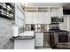 Efficient kitchen featuring stainless steel appliances and tile backsplash at 6045 Haverford Ave, Indianapolis, IN 46220