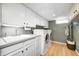 Bright laundry room with ample storage, updated appliances, modern sink, and a convenient folding area at 6045 Haverford Ave, Indianapolis, IN 46220