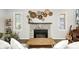 Bright living room features a stone fireplace, large windows, and stylish decor at 6045 Haverford Ave, Indianapolis, IN 46220