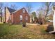 Well-maintained backyard featuring patio area, privacy fence and mature trees at 6640 E Washington St, Indianapolis, IN 46219
