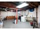 Unfinished basement with laundry area and utility sink at 6640 E Washington St, Indianapolis, IN 46219