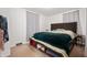 Cozy bedroom with carpet flooring and a comfortable-looking bed at 6640 E Washington St, Indianapolis, IN 46219