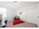 Attic bedroom with a chair and red rug at 6640 E Washington St, Indianapolis, IN 46219