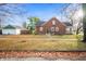 Well-maintained brick two-story home with front yard and detached garage at 6640 E Washington St, Indianapolis, IN 46219