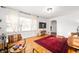 Bright living room with hardwood floors, large windows, neutral walls and stylish decor at 6640 E Washington St, Indianapolis, IN 46219