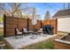 Paver patio with seating, table, umbrella and grill at 6640 E Washington St, Indianapolis, IN 46219