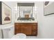 Bathroom features a modern vanity with marble countertop, chrome fixtures, and stylish wall art at 6704 Hoover Rd, Indianapolis, IN 46260