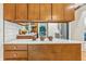 Modern kitchen features wooden cabinets, quartz countertops, and stainless steel appliances at 6704 Hoover Rd, Indianapolis, IN 46260
