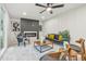 Bright living room with fireplace, modern furnishings and large windows at 6704 Hoover Rd, Indianapolis, IN 46260