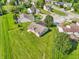 Aerial view capturing backyard featuring a well-maintained lawn and mature trees at 7456 Jack Pine Ct, Avon, IN 46123