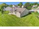 Aerial view of the home's backyard featuring a well-maintained lawn and patio, perfect for outdoor enjoyment at 7456 Jack Pine Ct, Avon, IN 46123