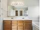 Spacious bathroom with double vanity, large mirror, tub, and separate shower at 7456 Jack Pine Ct, Avon, IN 46123