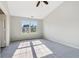 Bedroom featuring ceiling fan, neutral carpet, and a window view at 7456 Jack Pine Ct, Avon, IN 46123
