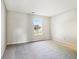 Empty bedroom with neutral carpet and a sunlit window view at 7456 Jack Pine Ct, Avon, IN 46123