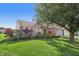 Attractive home featuring a lush green lawn, mature trees, and an attached garage at 7456 Jack Pine Ct, Avon, IN 46123