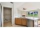 Open kitchen with stainless steel dishwasher, double sinks, and natural lighting at 7456 Jack Pine Ct, Avon, IN 46123