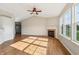 Bright living room featuring hardwood floors, a fireplace, and large windows at 7456 Jack Pine Ct, Avon, IN 46123
