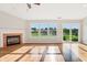 Spacious living room with hardwood floors, fireplace, and sliding glass door to backyard at 7456 Jack Pine Ct, Avon, IN 46123