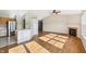 Open-concept living room featuring a fireplace and seamless transition to the kitchen at 7456 Jack Pine Ct, Avon, IN 46123