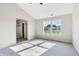 Main bedroom featuring ceiling fan, neutral carpet, and a window view at 7456 Jack Pine Ct, Avon, IN 46123