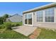 Sunroom exterior with sliding glass door, tan siding and grassy lawn in a residential neighborhood at 7456 Jack Pine Ct, Avon, IN 46123