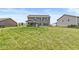Extensive backyard featuring a covered patio, well-maintained lawn, and ample space for outdoor activities at 7603 Merrick Dr, Brownsburg, IN 46112