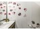 Bathroom featuring fresh decor, a sink with counter space, and modern fixtures at 7603 Merrick Dr, Brownsburg, IN 46112