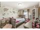 Adorable bedroom featuring bright décor, floral wall accents, and comfortable furniture at 7603 Merrick Dr, Brownsburg, IN 46112