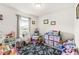 Bright bedroom filled with toys, featuring a large window and neutral walls at 7603 Merrick Dr, Brownsburg, IN 46112