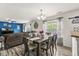 Open dining area with wood table, plenty of natural light, and view to living space at 7603 Merrick Dr, Brownsburg, IN 46112