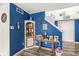Entryway with blue walls, staircase, and decorative table at 7603 Merrick Dr, Brownsburg, IN 46112