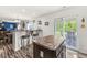 Bright eat-in kitchen with stainless steel appliances, and an outdoor view through sliding glass doors at 7603 Merrick Dr, Brownsburg, IN 46112