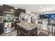 Charming kitchen featuring stainless steel appliances, a kitchen island, and dark wood cabinetry at 7603 Merrick Dr, Brownsburg, IN 46112