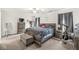 Spacious main bedroom with ample natural light, a ceiling fan, and modern furnishings at 7603 Merrick Dr, Brownsburg, IN 46112