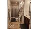 Traditional bathroom with tile flooring, shower, toilet, and vanity with wood cabinets at 7870 E County Road 150 S, Avon, IN 46123