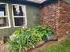 Close up of landscaped home exterior corner with hostas, brick and vinyl siding at 7870 E County Road 150 S, Avon, IN 46123