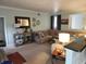 Comfortable living room with soft green walls, plush sectional sofa, and decorative wall art at 7870 E County Road 150 S, Avon, IN 46123