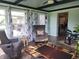 Comfortable sun room with lots of natural light, hardwood floors, and comfortable seating at 7870 E County Road 150 S, Avon, IN 46123