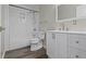 Bathroom featuring a white vanity and toilet and a shower/tub with white subway tile at 802 N Tuxedo St, Indianapolis, IN 46201