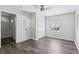 Bright bedroom features plank flooring, a window, and a closet at 802 N Tuxedo St, Indianapolis, IN 46201