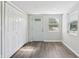 Bright entryway featuring wood floors, a white door with decorative glass, and a closet at 802 N Tuxedo St, Indianapolis, IN 46201