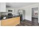 Bright kitchen features granite countertops, stainless steel appliances, and an adjoining dining area at 802 N Tuxedo St, Indianapolis, IN 46201