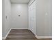 Laundry room with hardwood floors and a closet for storage at 802 N Tuxedo St, Indianapolis, IN 46201